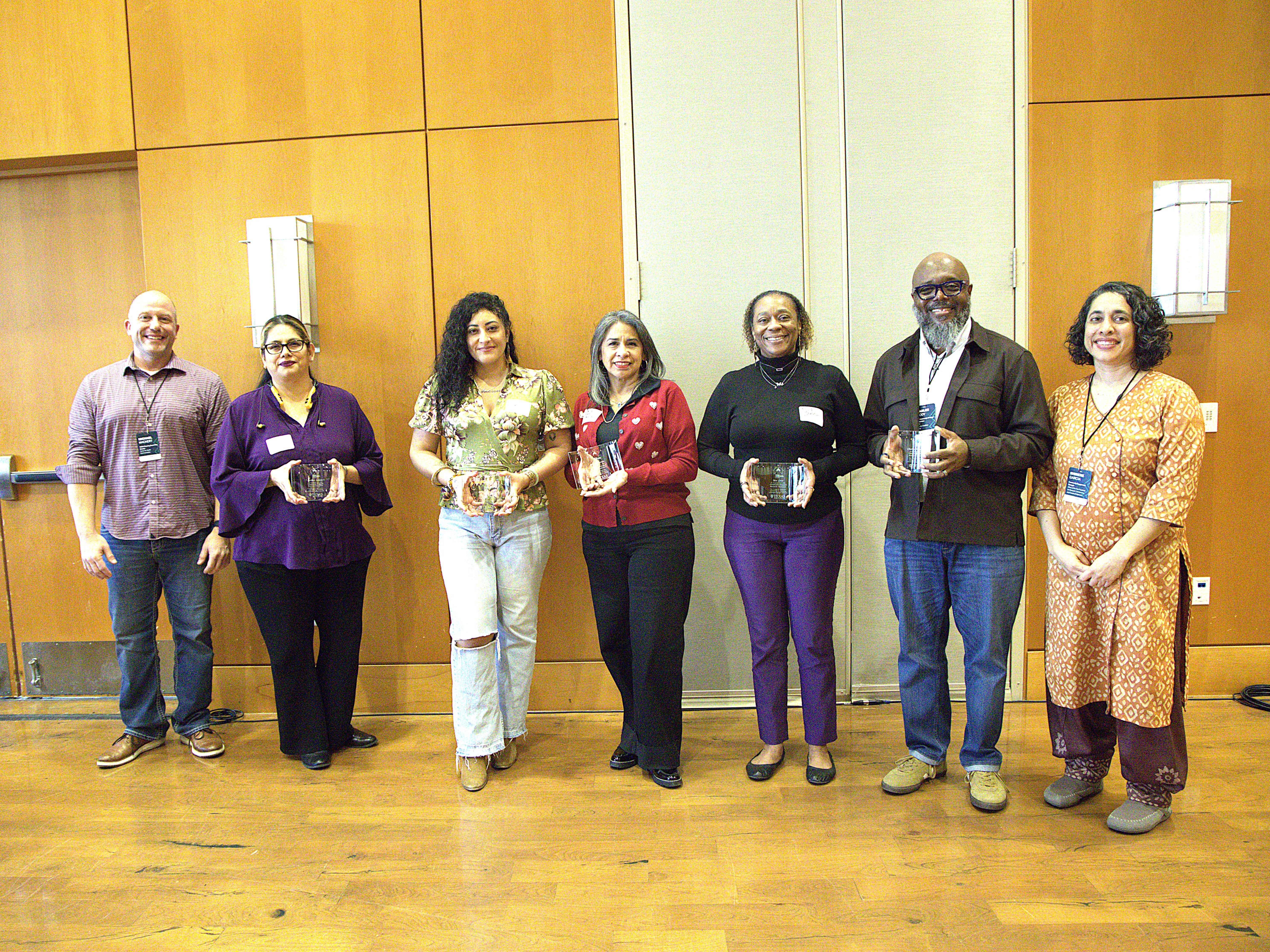 Left to right: Whole Communities–Whole Health (WCWH) chair Mike Mackert, Barbara Soriano, Ellena Gonzales, Rebecca Gomez, Mia Greer, Dr. Charles Moody and WCWH Community Engagement Manager Shirene Garcia pose at the 2026 WCWH Symposium. (Not pictured: Maggie Jaime and Carol Lilly.)