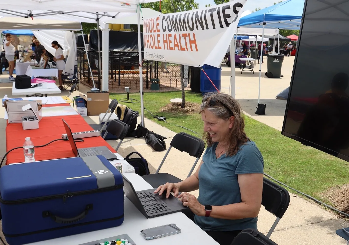 Kerry Kinney from the Maseeh Department of Civil, Architectural and Environmental Engineering demonstrates one of the indoor air quality measurement tools used by WCWH at Del Valle Day 2023 Kerry Kinney from the Maseeh Department of Civil, Architectural and Environmental Engineering demonstrates one of the indoor air quality measurement tools used by WCWH at Del Valle Day 2023