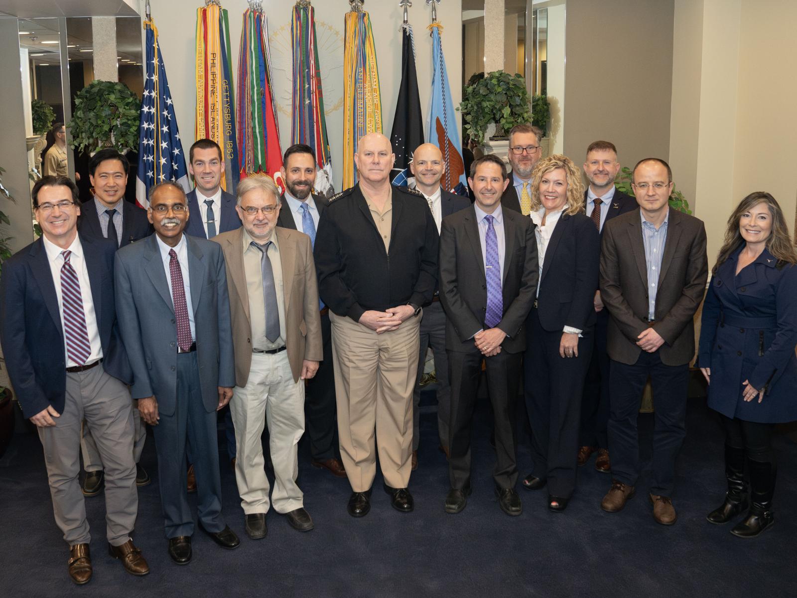 Good Systems’ Luis Sentis (far left), Matthew Lease (seventh from right) and Peter Stone (sixth from right) with Admiral Christopher W. Grady (front row, center) Good Systems’ Luis Sentis (far left), Matthew Lease (seventh from right) and Peter Stone (sixth from right) with Admiral Christopher W. Grady (front row, center)