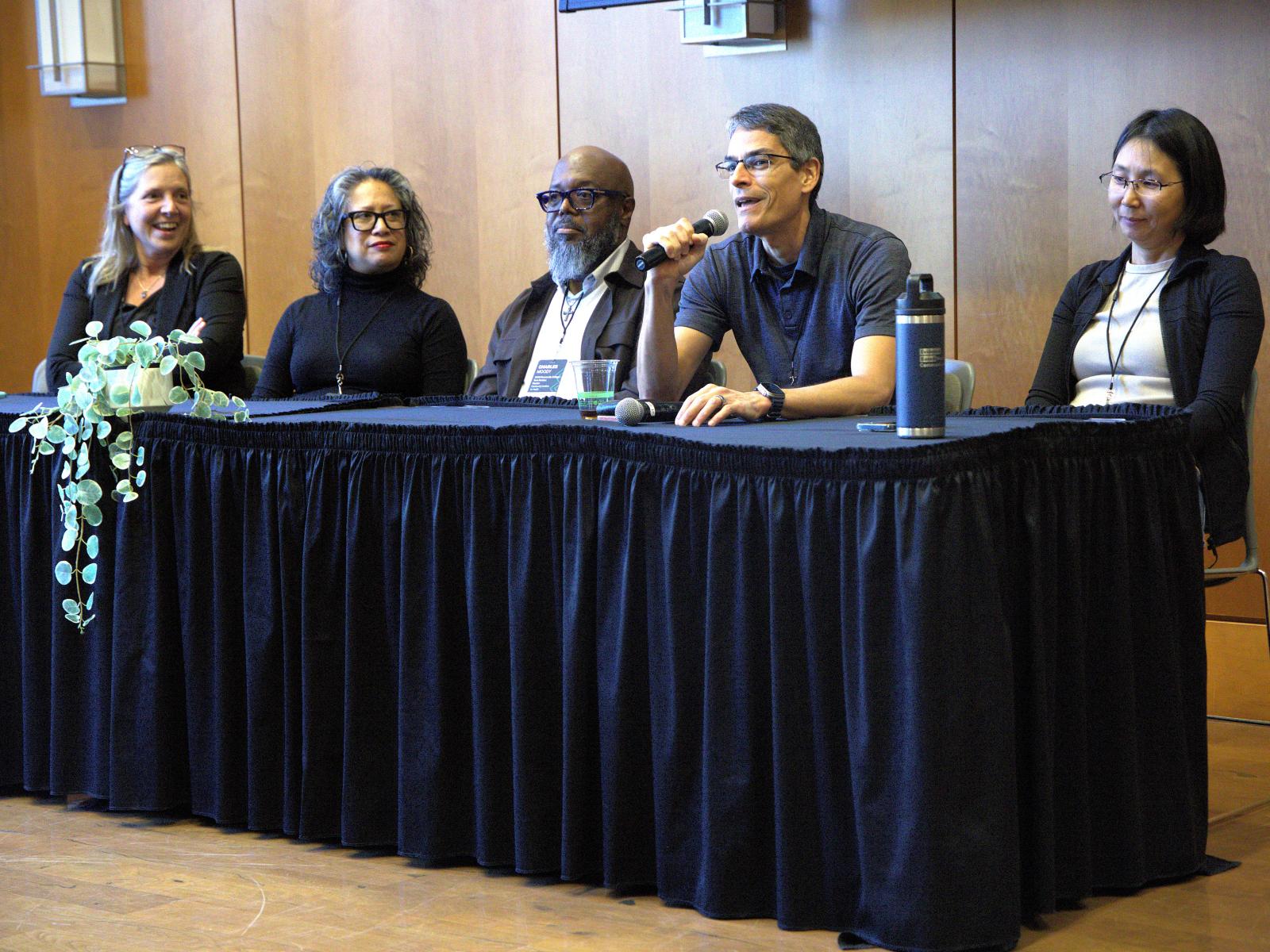 Edison Thomaz (second from right), an associate professor of electrical and computer engineering, speaks at this year’s Whole Communities–Whole Health Research Symposium, held at UT Austin on February 6. Joining him on the panel, from left to right: Kerry Kinney, Isela Guerra, Charles Moody, Jr. and Yan Zhang.