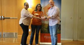 Araceli McBeth and Rebecca Gomez, parent community liaisons at Newton Collins Elementary School and Ojeda Middle School, respectively, accept the Cornerstone Award from WCWH chair Mike Mackert on behalf of DVISD. 