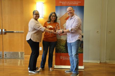 Araceli McBeth and Rebecca Gomez, parent community liaisons at Newton Collins Elementary School and Ojeda Middle School, respectively, accept the Cornerstone Award from WCWH chair Mike Mackert on behalf of DVISD. 