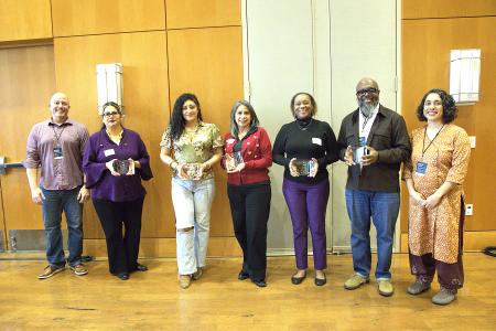 Left to right: Whole Communities–Whole Health (WCWH) chair Mike Mackert, Barbara Soriano, Ellena Gonzales, Rebecca Gomez, Mia Greer, Dr. Charles Moody and WCWH Community Engagement Manager Shirene Garcia pose at the 2026 WCWH Symposium. (Not pictured: Maggie Jaime and Carol Lilly.)