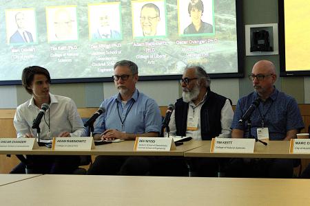 Oscar Ovanger (left) moderates a panel at the 2026 Planet Texas 2050 Symposium at UT Austin, in March. Seated next to him, from left to right, are his three postdoctoral advisers: Professors Adam Rabinowitz, Dev Niyogi and Tim Keitt.